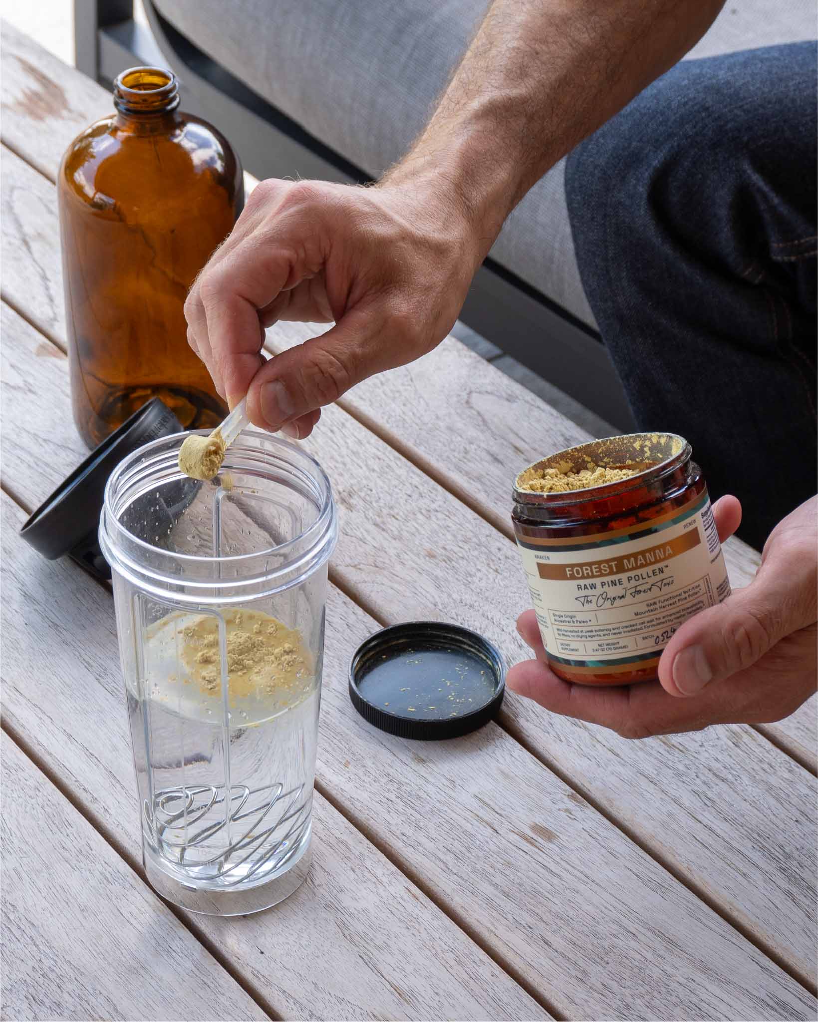 Measuring a serving of RAW Pine Pollen with a spoon