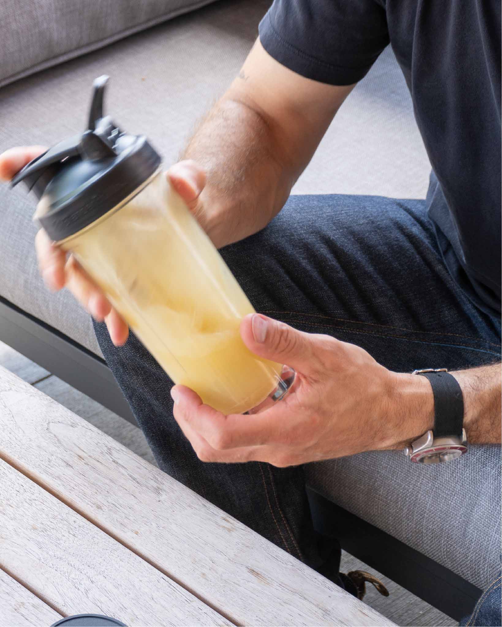 Stirring RAW Pine Pollen into a glass of water before drinking