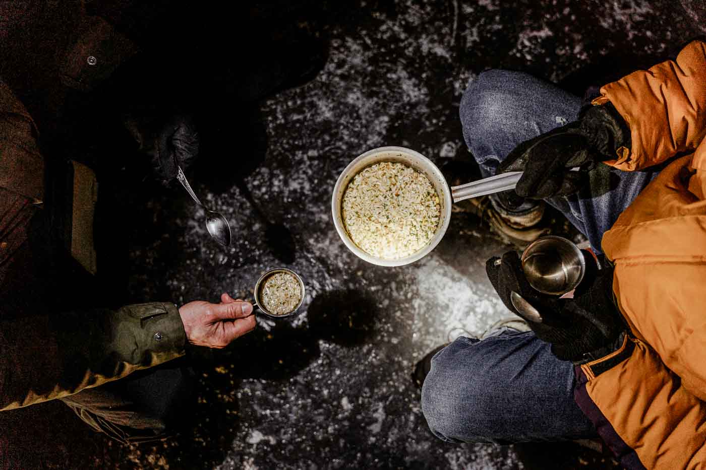 Warm winter congee shared outdoors, illustrating slow-cooked grains used in Chinese Dietary Therapy to conserve energy and support digestion